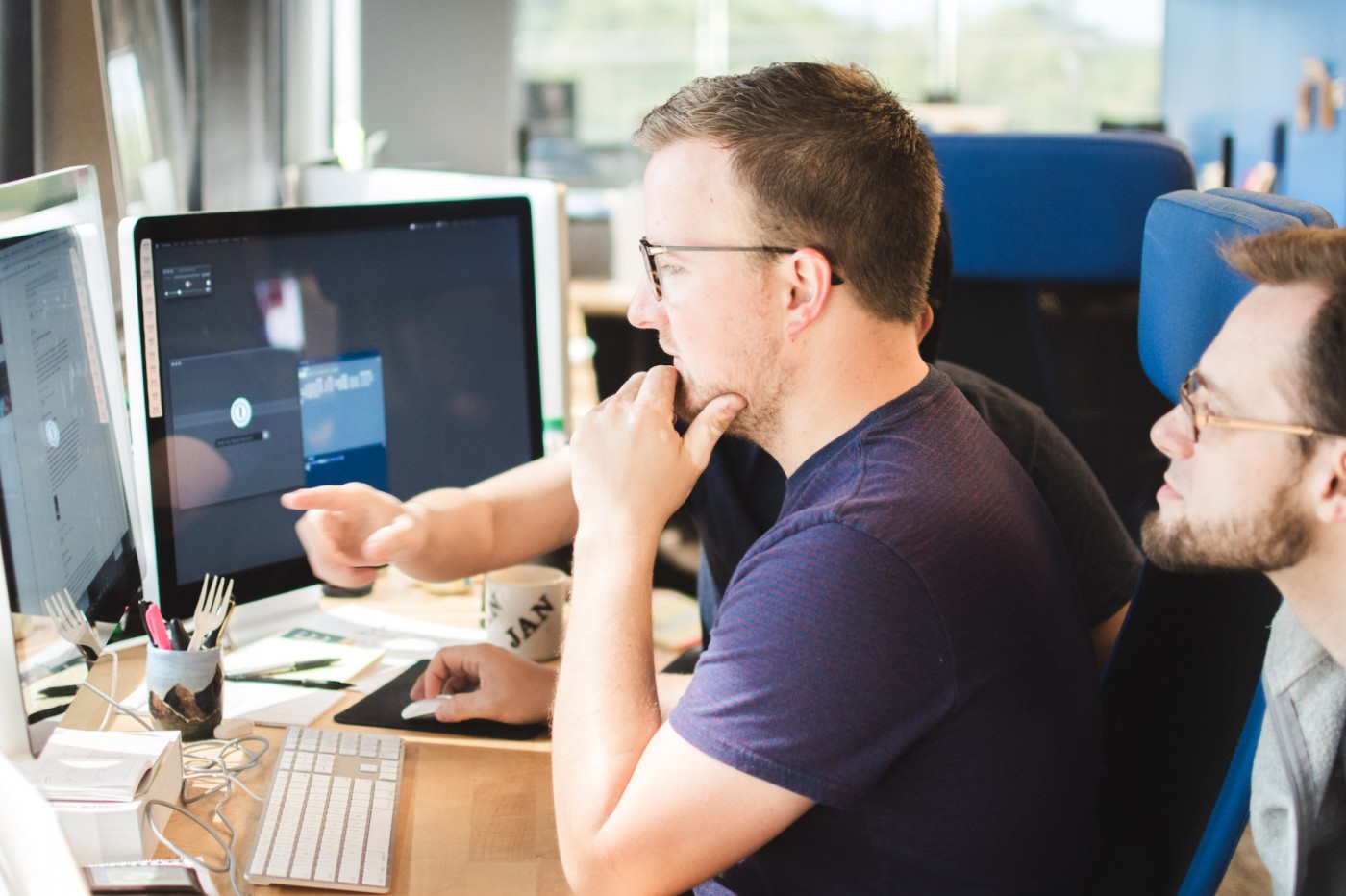Developer working on a project with assistance from other developers