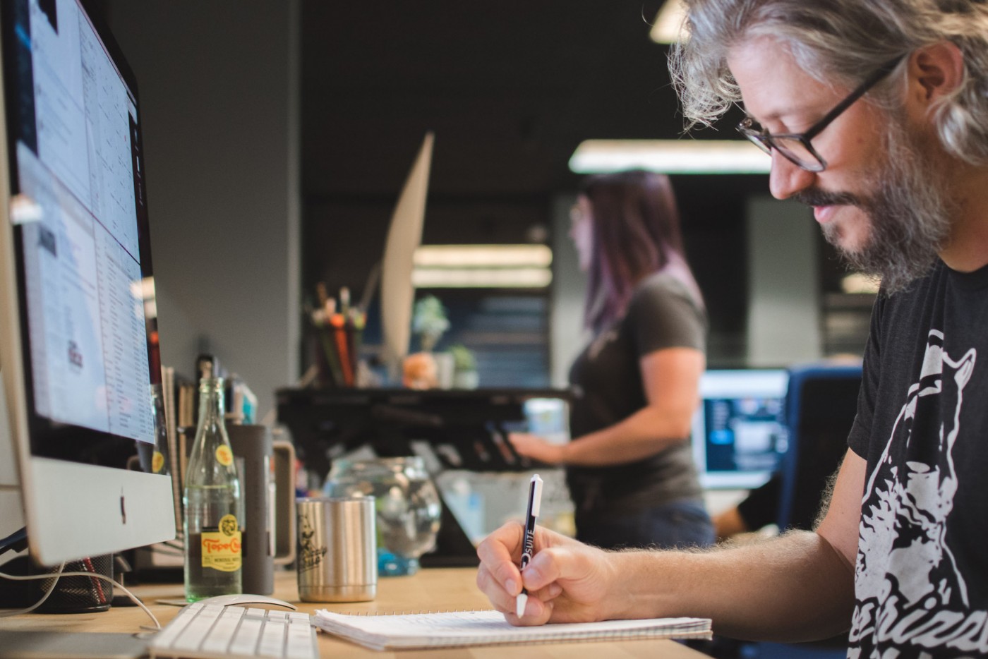 A designer taking notes on what he is working on